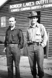Sig and Walter Hansen in front of Border Lakes Outfitters in Ely